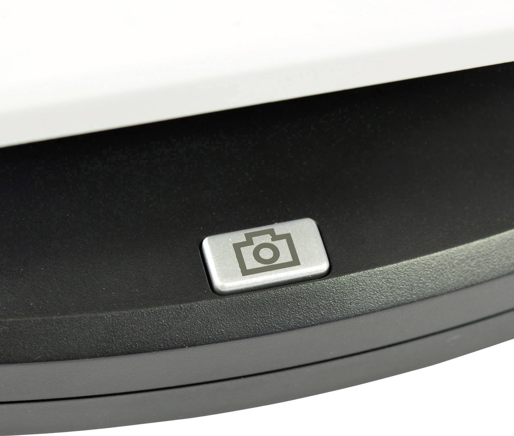 A silver button with a camera symbol on a black base, likely part of a device with photographic functionality.