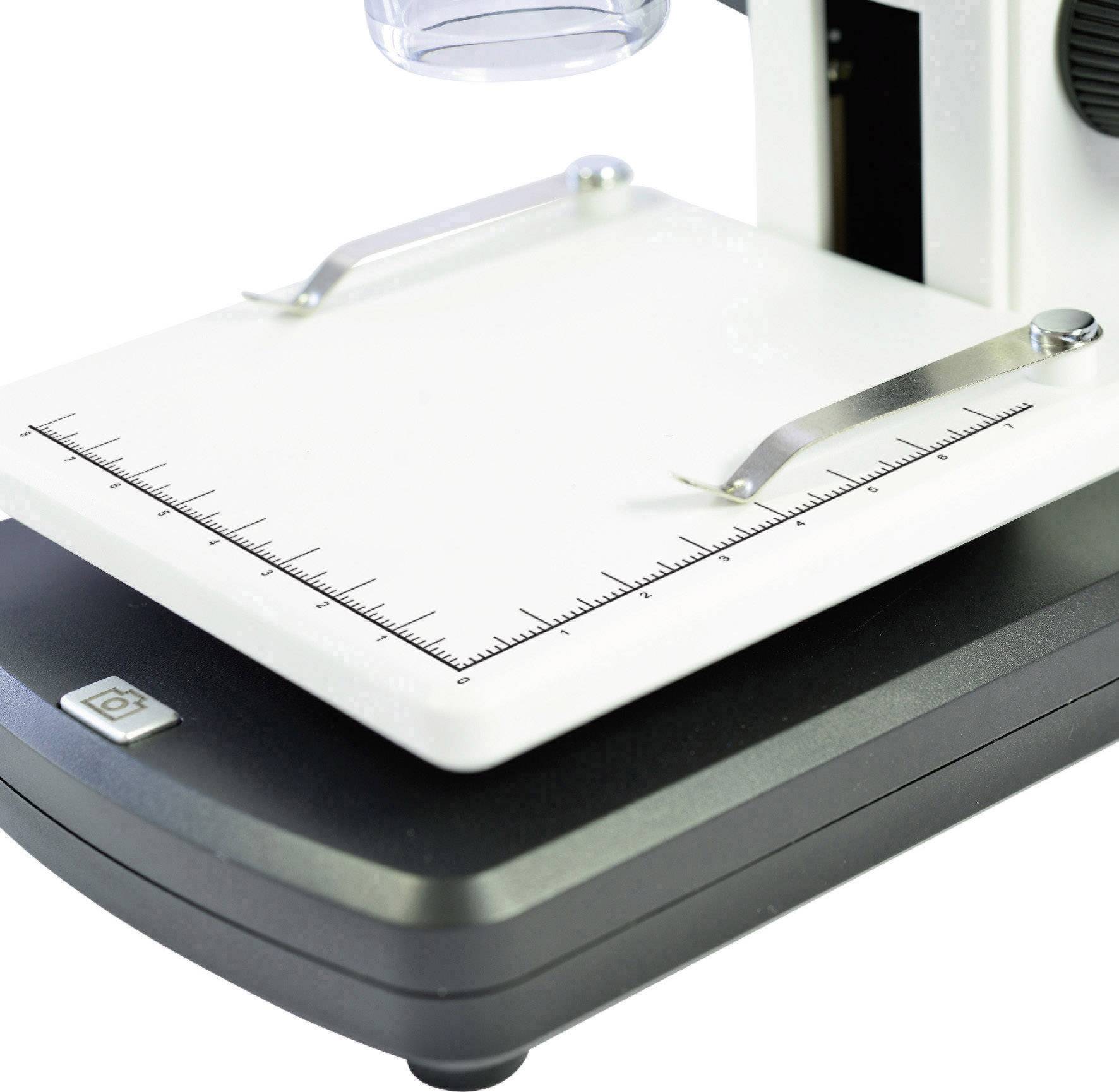 A digital microscope with measuring scale, showing the height-adjustable platform and a focus wheel. Ideal for precise observations.