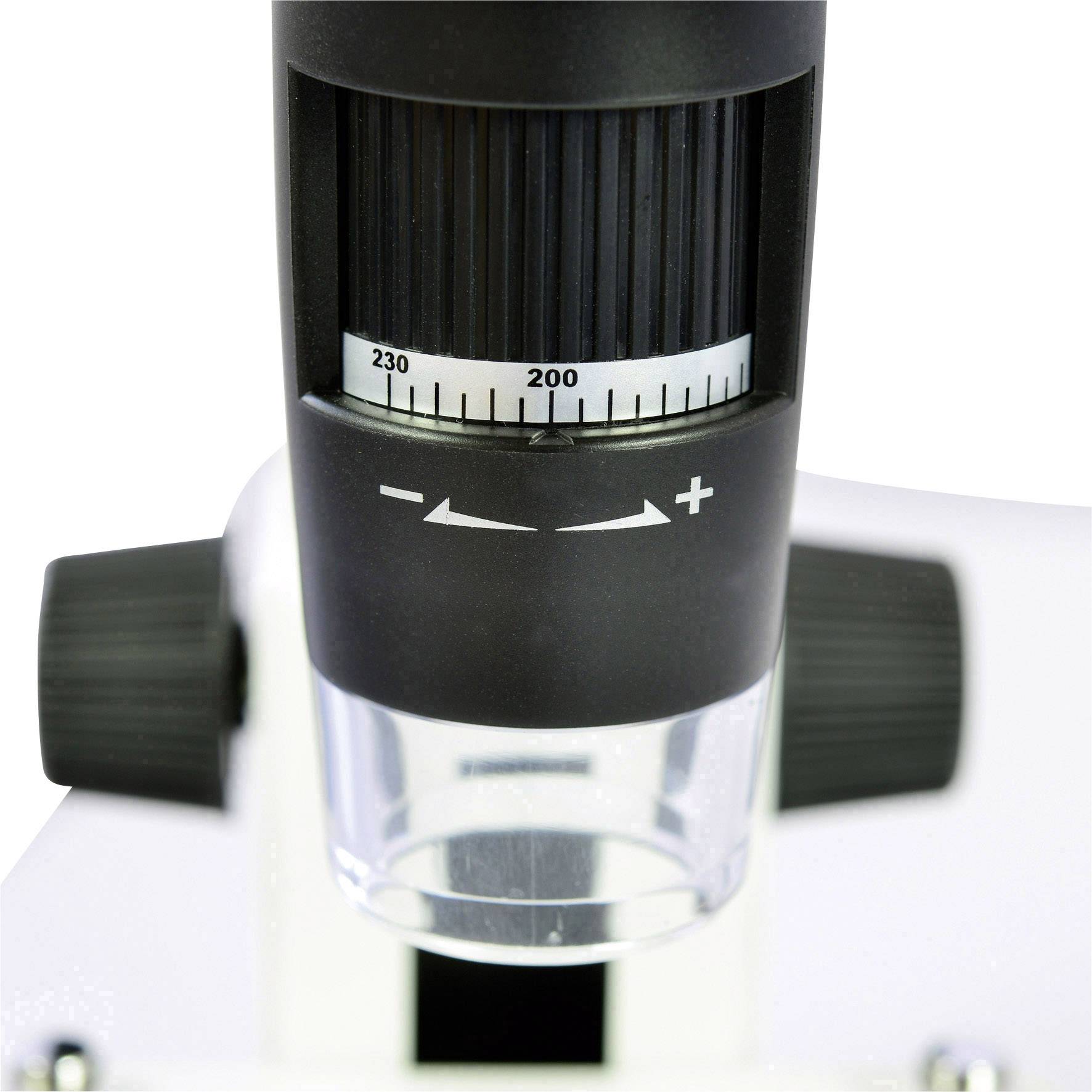 Shows the zoom control of a microscope, with a scale ranging from 200 to 230, to control the magnification.
