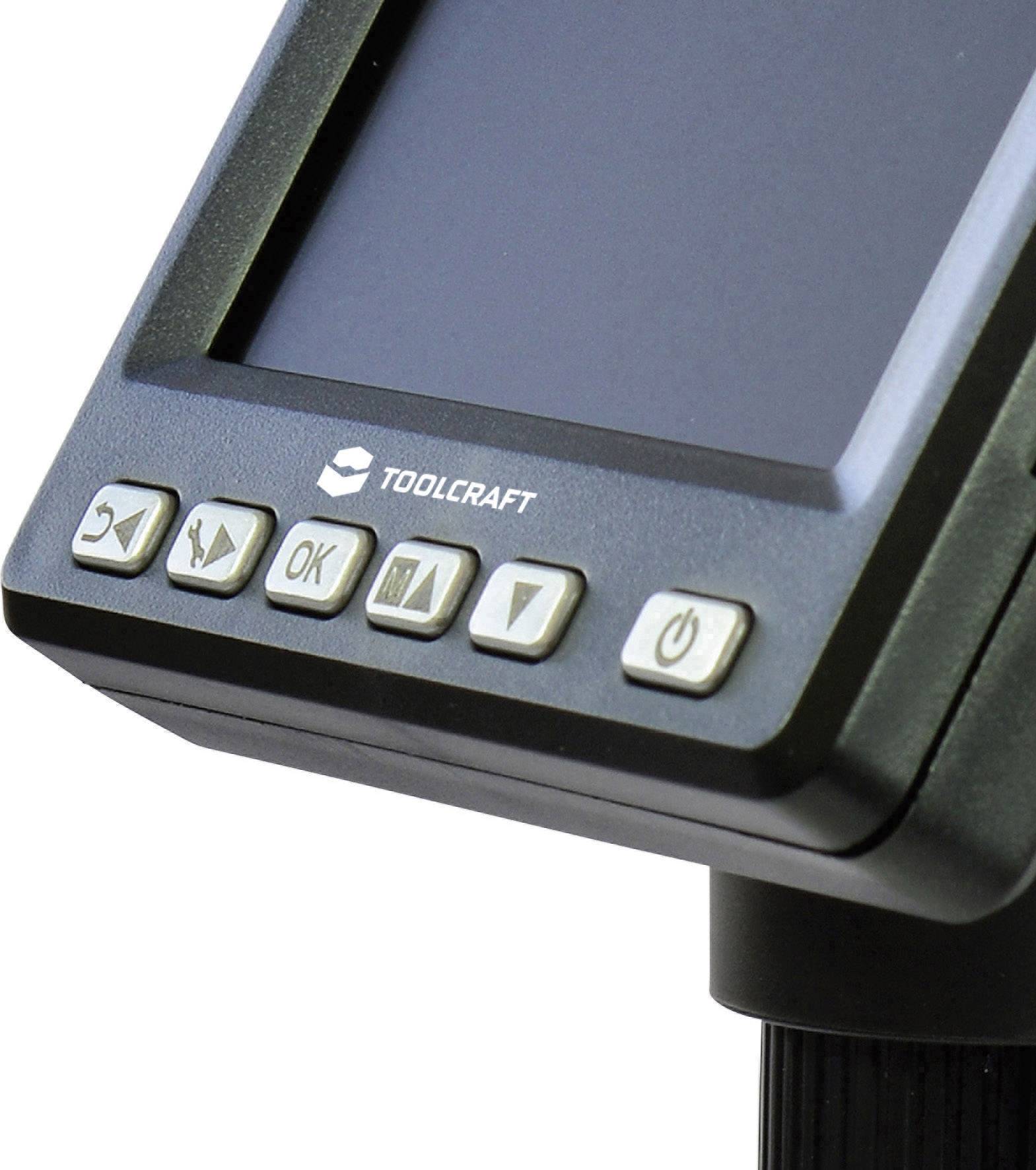 Close-up of an electronic device with a screen and control buttons, including 'OK' and a power switch symbol, by the Toolcraft brand.