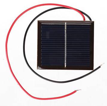 Small solar panel with two connected wires, one red and one black, on a white background.