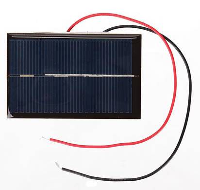 A small solar panel with red and black cables, suitable for simple electrical projects or demonstrating solar energy.