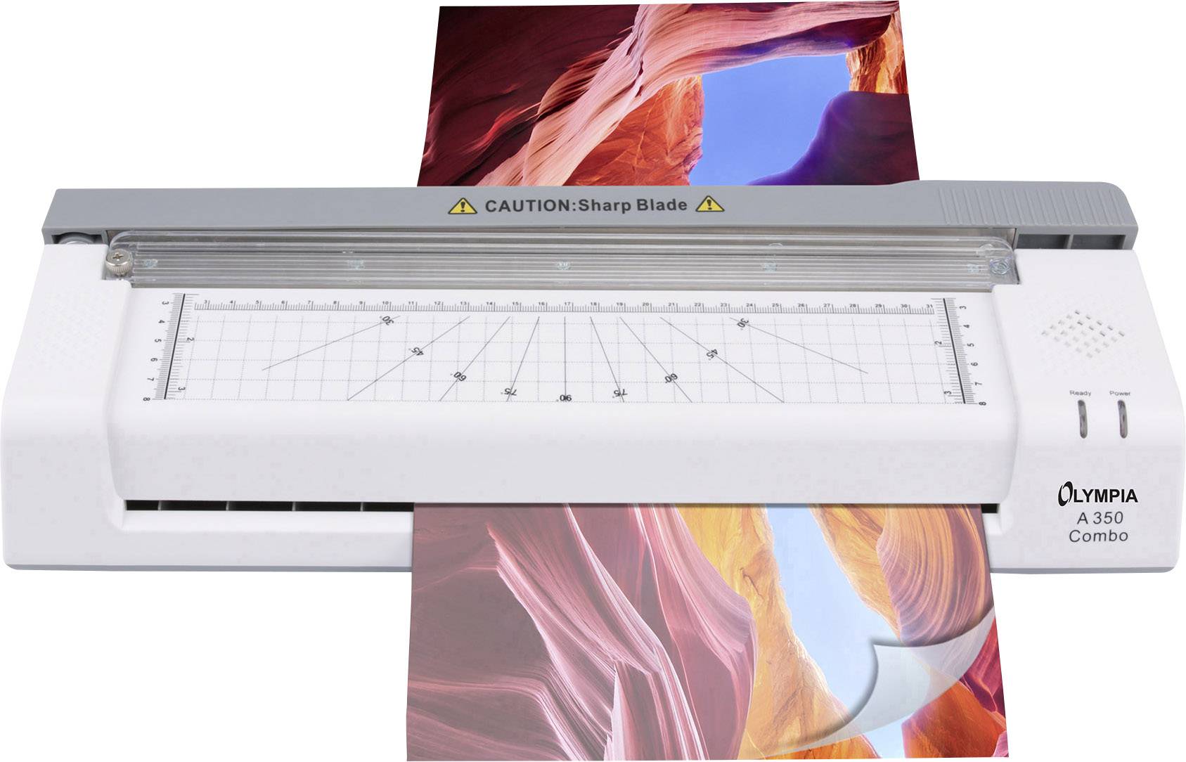 An Olympia A 350 Combo paper trimmer cuts a photograph of Antelope Canyon with striking orange and blue rock formations.