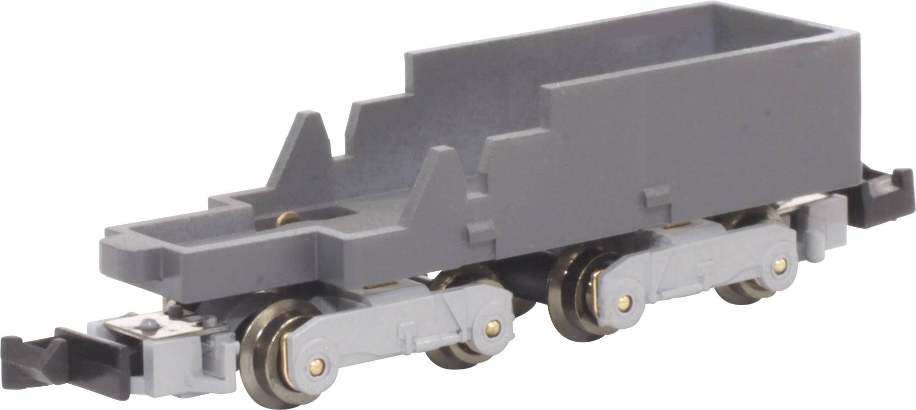 A grey model railway chassis without bodywork, with four silver wheels and a coupling mechanism at the front.