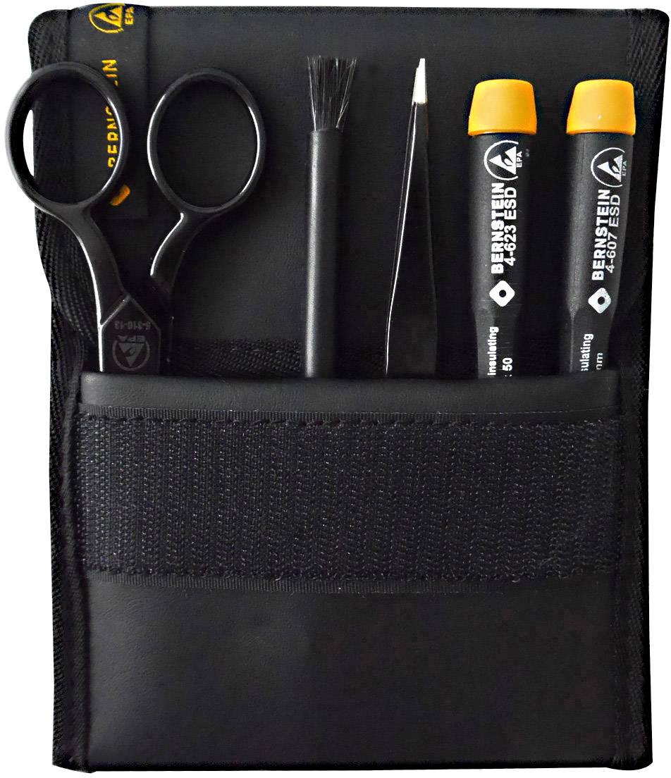 Black case with scissors, brush, tweezers and two pens, festively arranged, suitable for precise technical work.