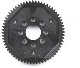 Black, octagonal gear wheel with a central hole and several small holes around the centre.