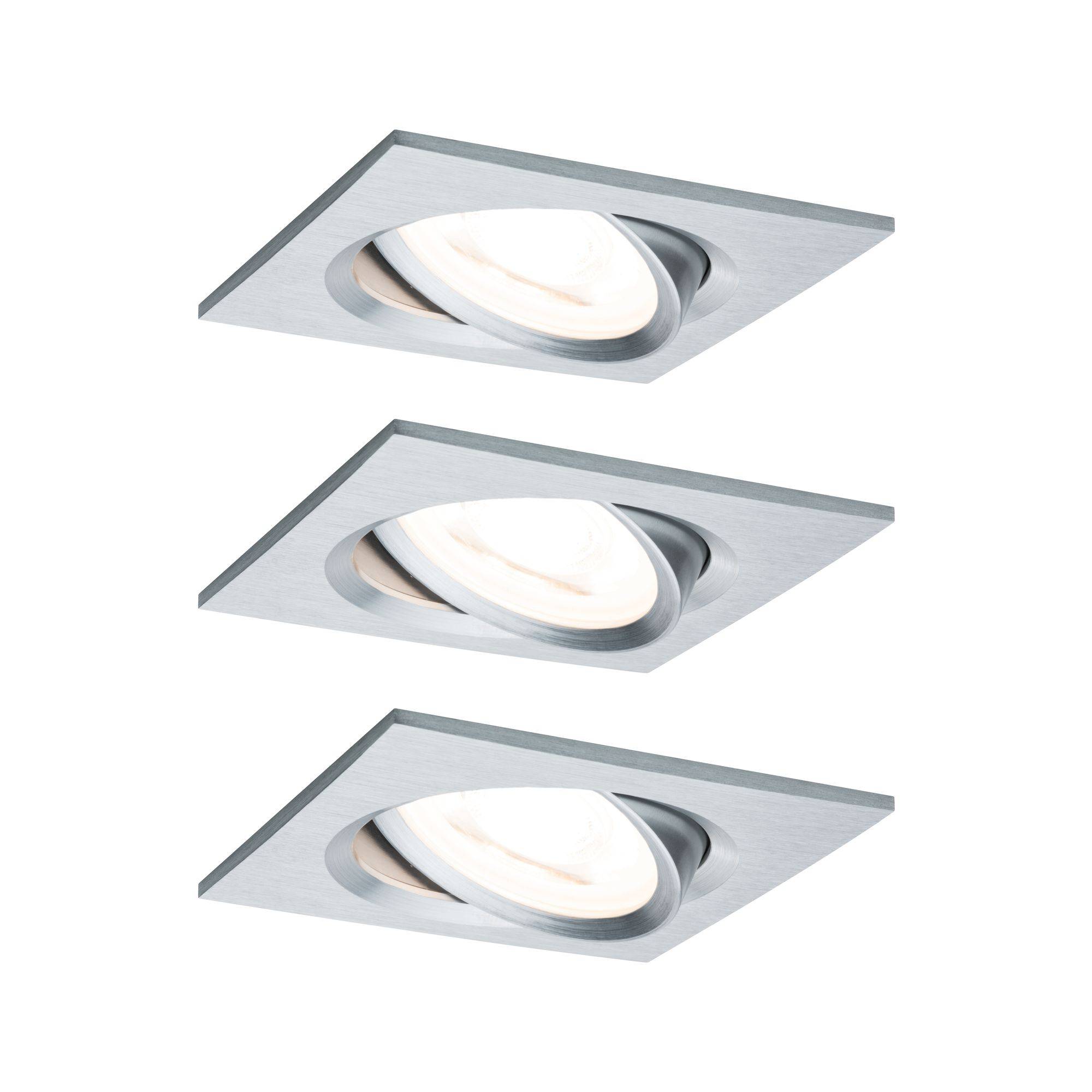 Three rectangular ceiling lights made of brushed metal with round, adjustable inserts that provide pleasantly diffused light.