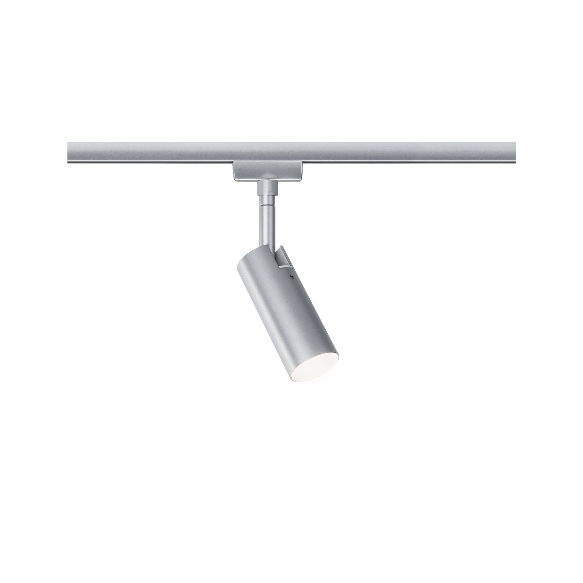 A silver spotlight on a track, directed straight downwards, emphasises the illumination of objects positioned beneath it.