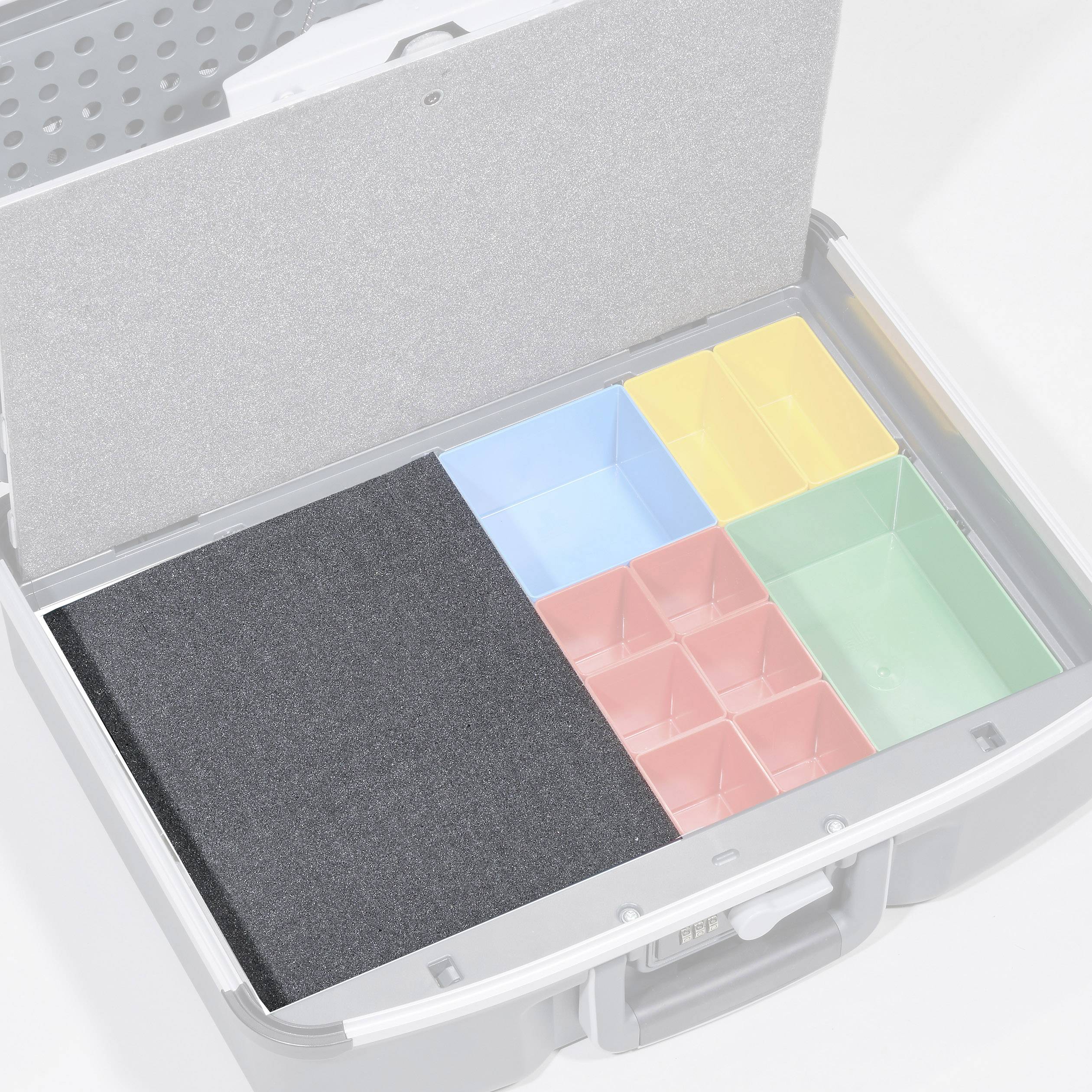 An open suitcase with various coloured compartments inside. On the left, a large black compartment, and on the right, smaller yellow, blue, red, and green compartments.