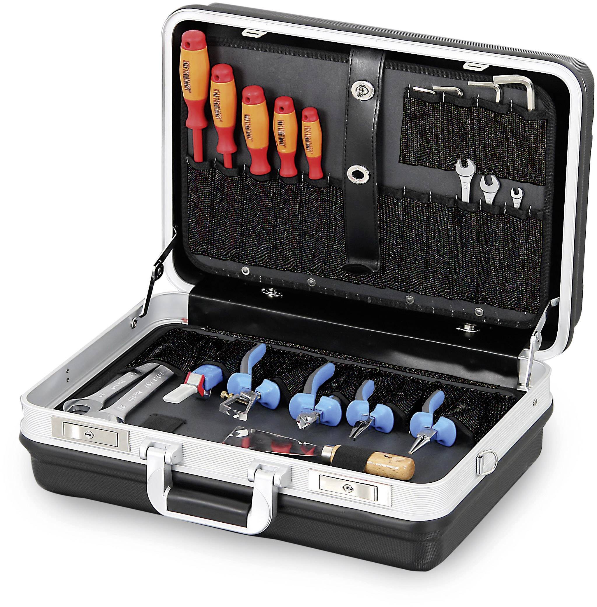 An opened toolbox with various screwdrivers, pliers, spanners, and other hand tools.