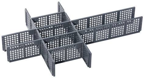 Plastic drawer insert with perforated pattern, comprising combs for flexible compartmentalisation.