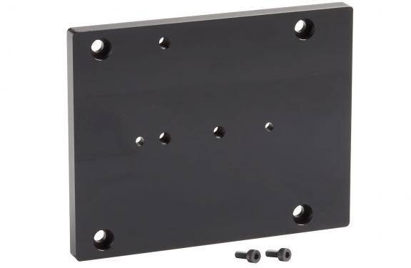Black rectangular metal plate with multiple screw holes, including two black screws.