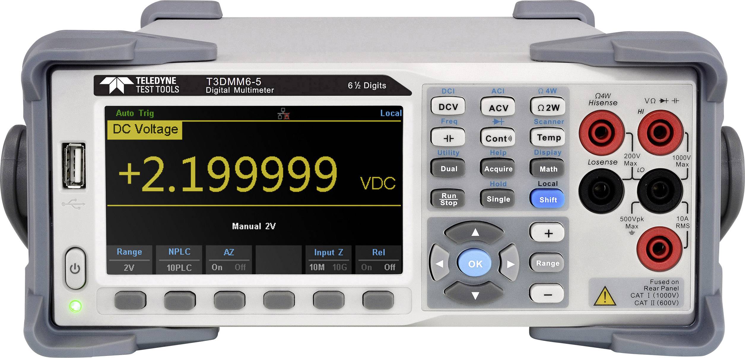 A digital multimeter displays a voltage of +2.199999 VDC on its display. It has numerous buttons for various measurement functions.