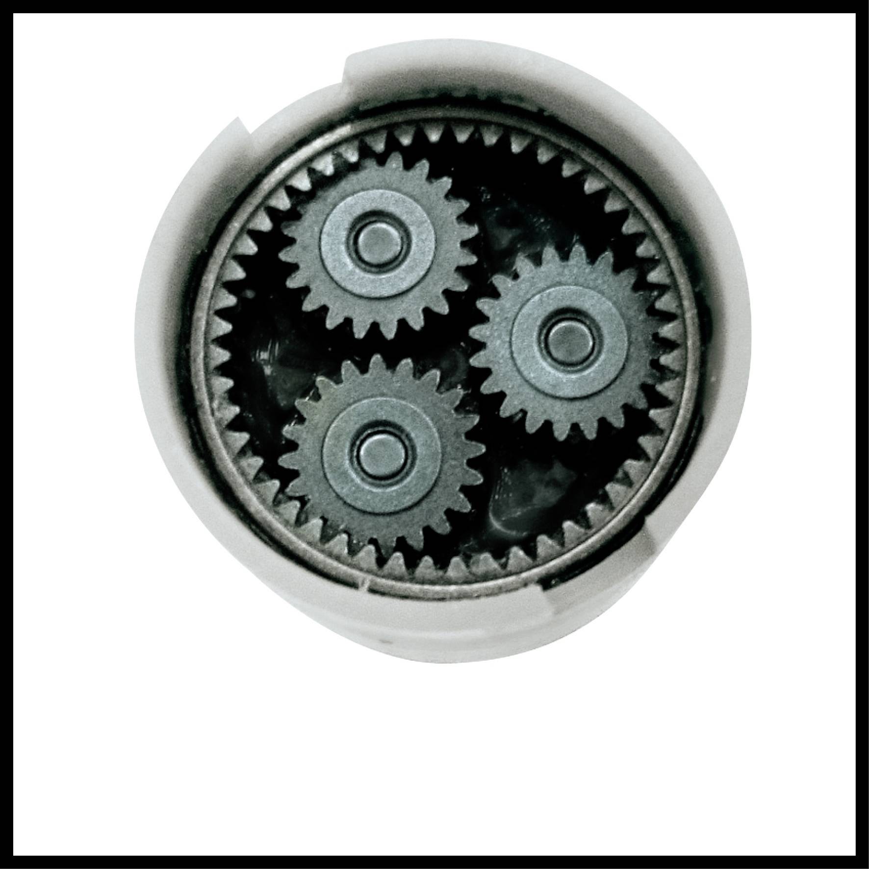 Four interlocking gears in a circular housing.