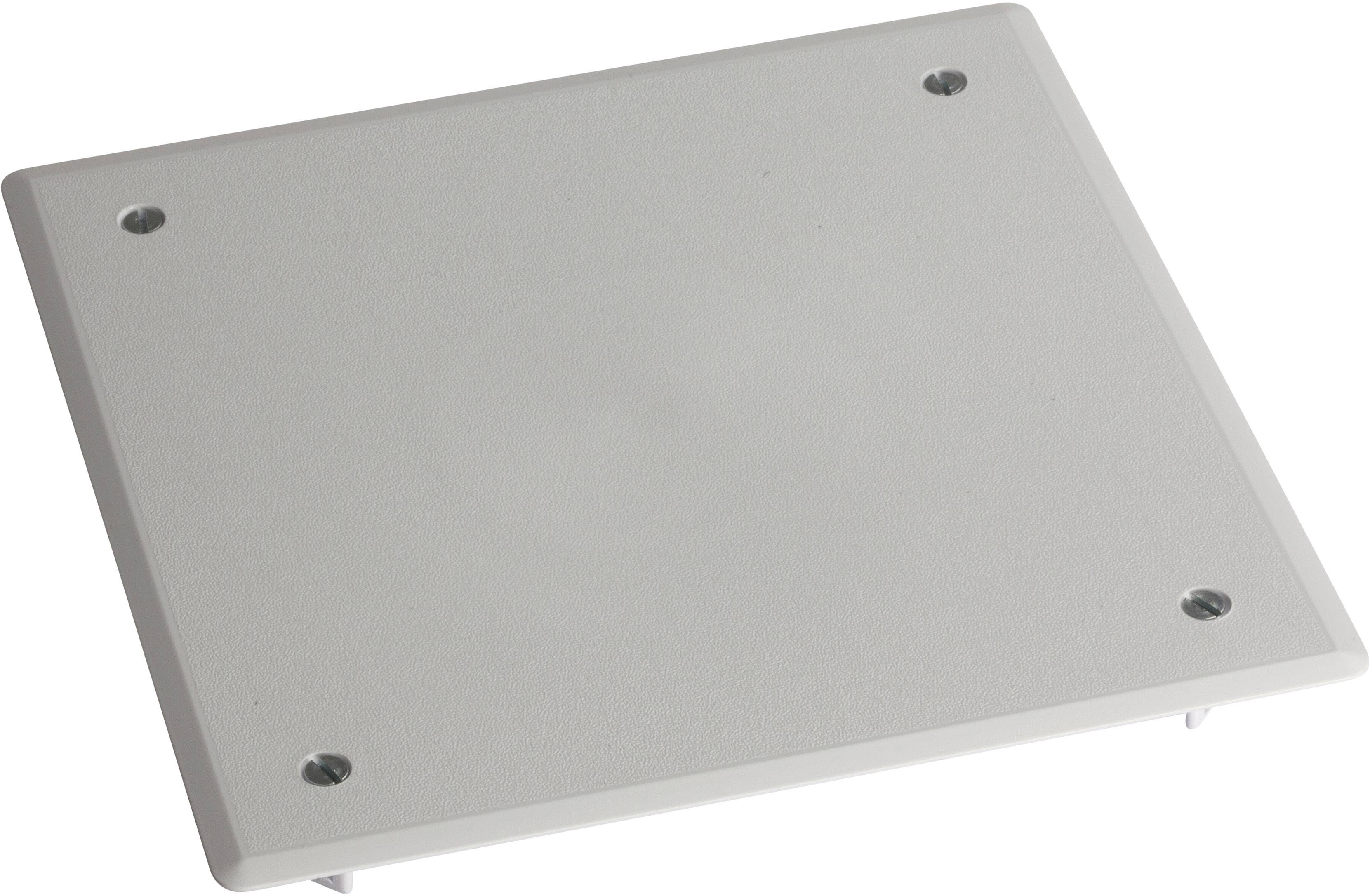 White, square metal plate with four visible screw holes at the corners, placed on a neutral, grey surface.