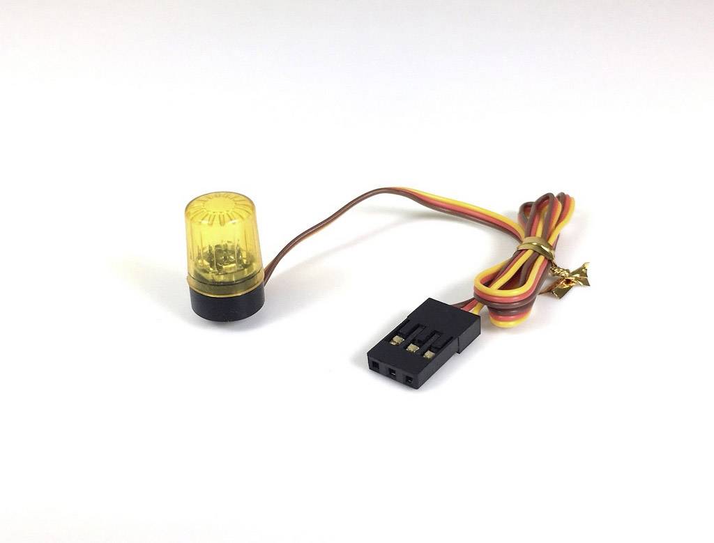 A yellow LED light with a cable and black plug, likely for electronic applications. The light appears to be space-efficient.