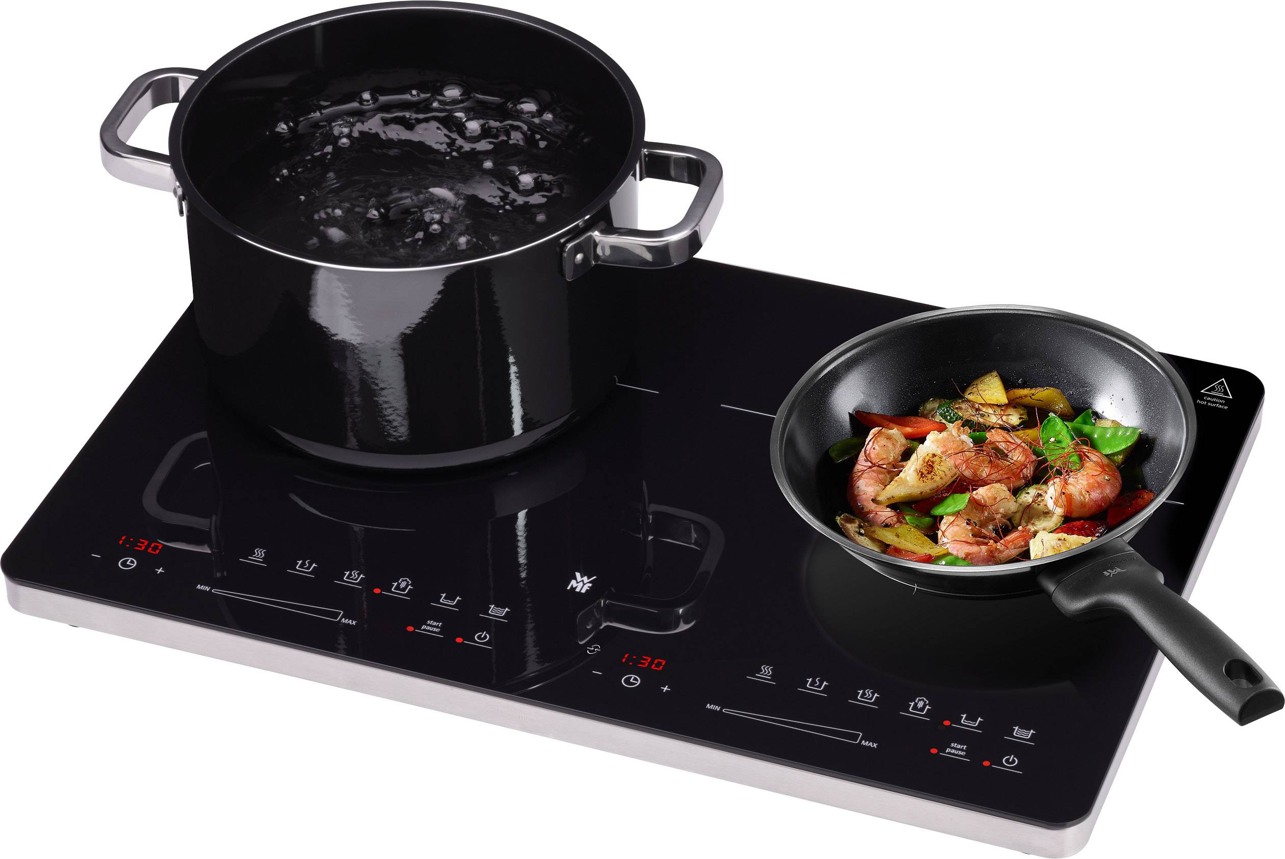 Electric hob with two hotplates: On the left is a pot of boiling water, and on the right, a pan with fried vegetables.