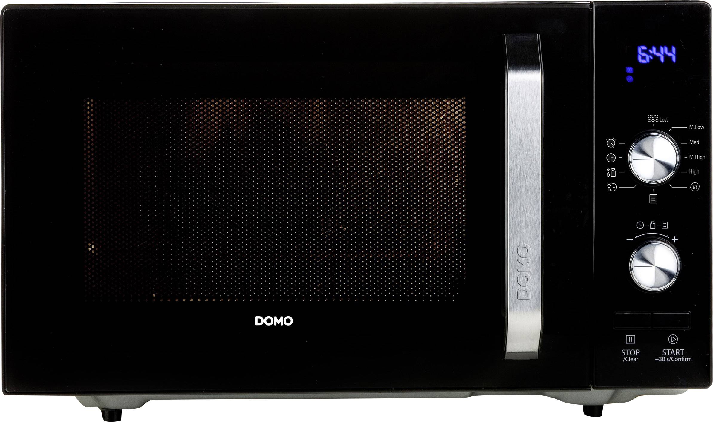 A black microwave with a digital clock display, two rotary knobs and a door with a viewing window; the time shows 6:44.