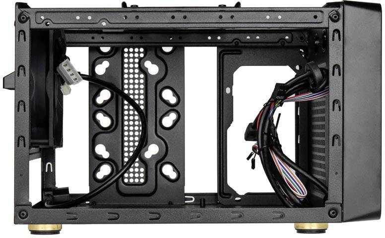 An open computer case viewed from the side, showing cables and fan mountings, ready for component installation.