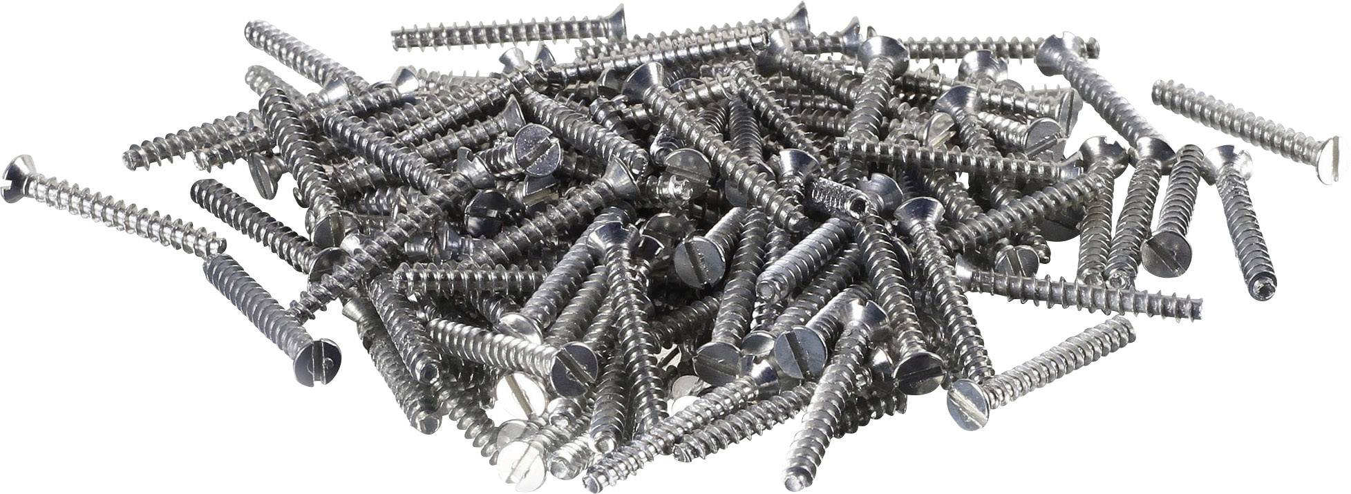 A pile of silver screws of varying lengths and sizes lies on a white background.