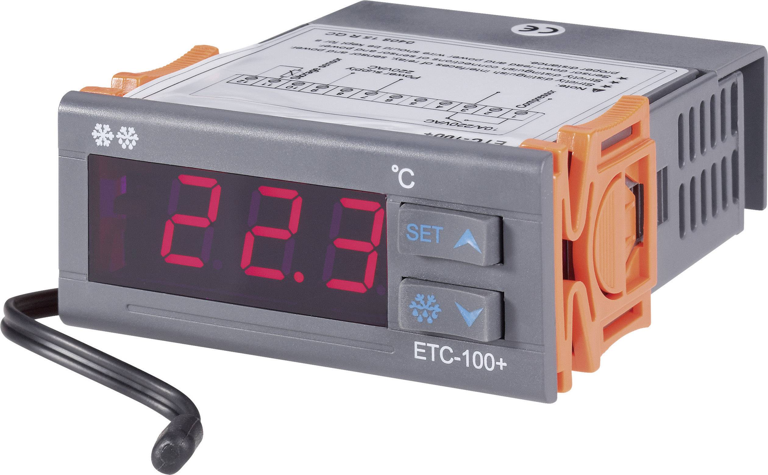 Electronic temperature control device with red LED display showing '22.3 °C'. Control buttons on the left, housing in grey and orange.