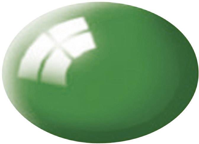 A single green dragée with a glossy surface and white reflections.