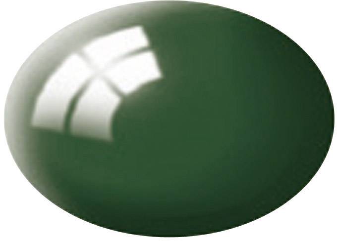 Dark green oval object, possibly a gemstone or glass bead, with a light reflection on its surface.