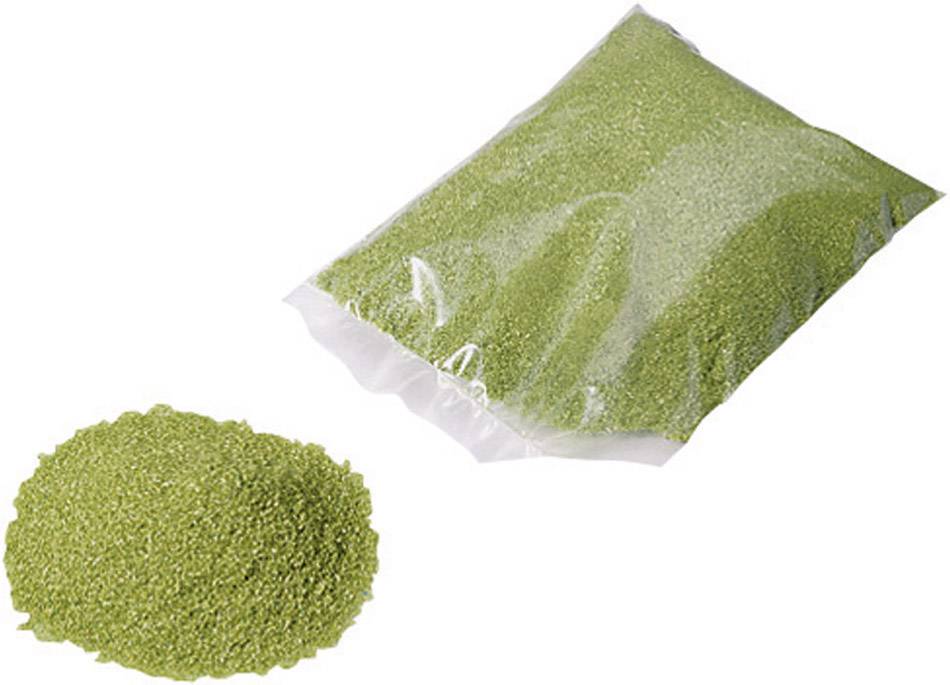 A bag of green granules and an equivalent pile beside it.