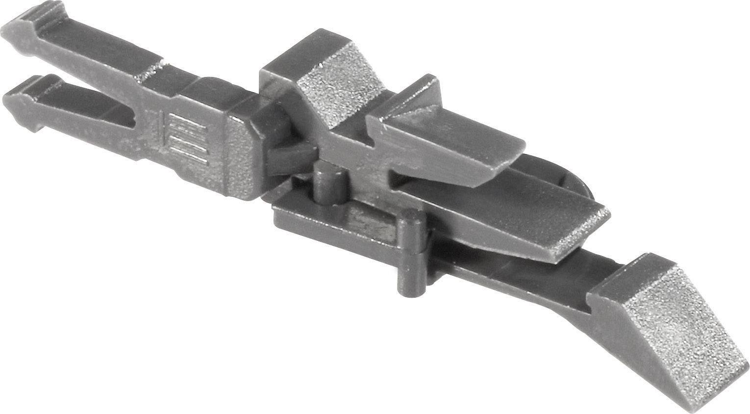 A grey plastic component that looks like a construction toy, possibly part of a larger model or set.