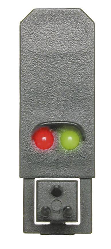 A model of a two-colour traffic light in miniature form with illuminating red and green lights, used for model railways to provide signalling.