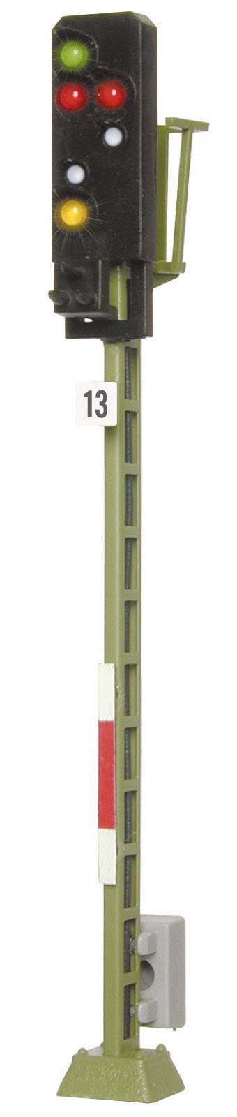 A railway signal with red, yellow, and green lights on a tall mast, numbered 13.