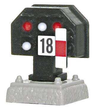 Toy railway signal with the number 18, showing two red, one white light.