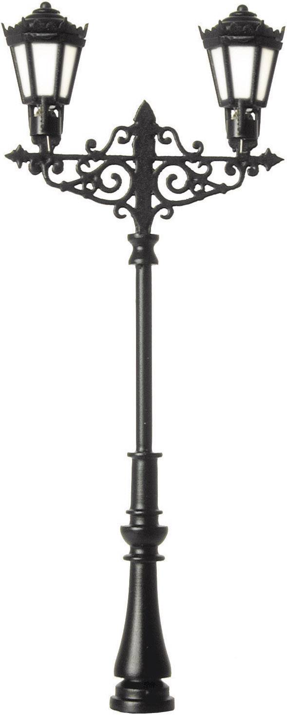 A decorative, antique metal street lamp with two lanterns, which are shining brightly. It stands against a neutral background.