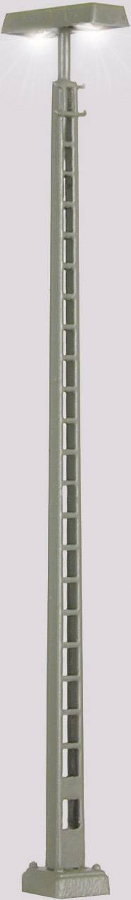 A modern standard lamp with a rectilinear, lattice-like shaft design and a plain rectangular base, illuminated from above.