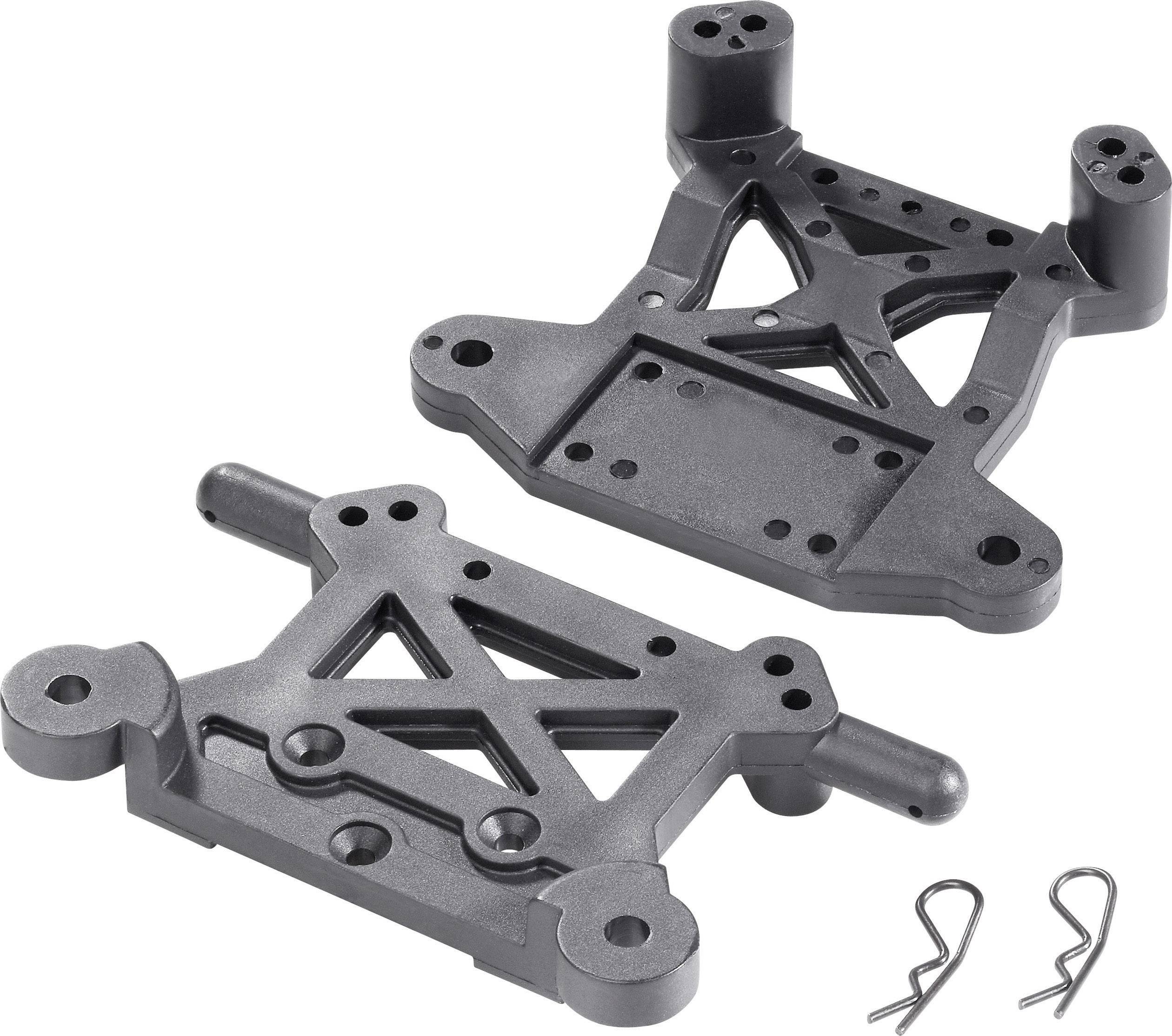Two black plastic parts with diamond-shaped cut-outs, possibly components of a model or toy vehicle. Alongside them, two metal clips.