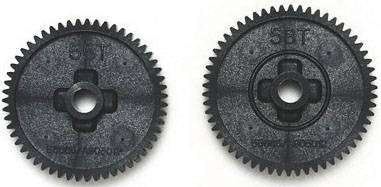 Two black gears with '58T' inscription, lying side by side. They have a central opening and are identically designed.