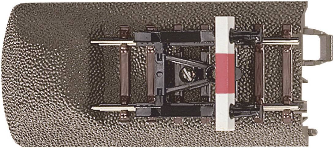 A model railway track connection with tracks and connecting elements made of plastic and metal, used for electric model trains.