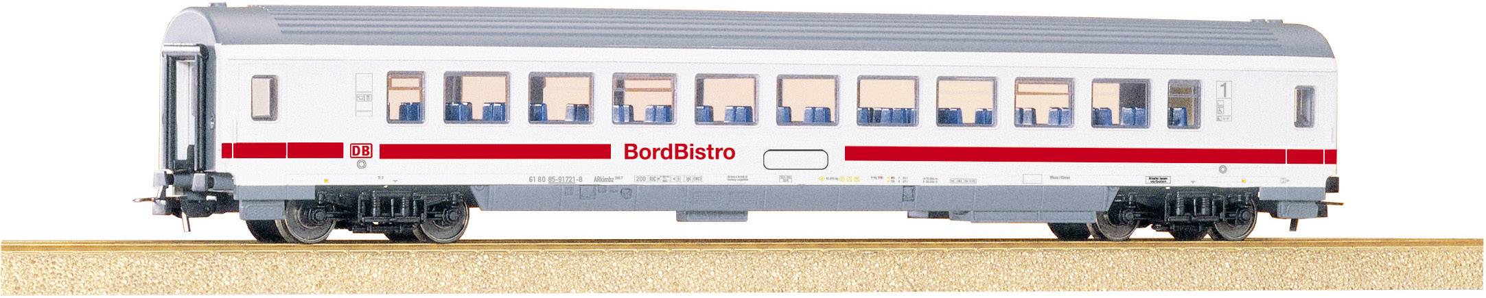 A model of a BordBistro carriage on a track, white with a red stripe, many windows, blue and white seats visible inside.