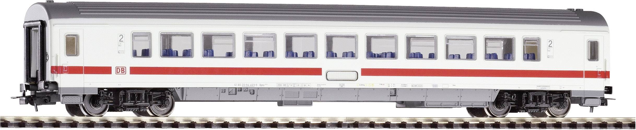 A white passenger carriage with a red stripe from Deutsche Bahn on a railway track. It has many windows and the number '2' is visible.