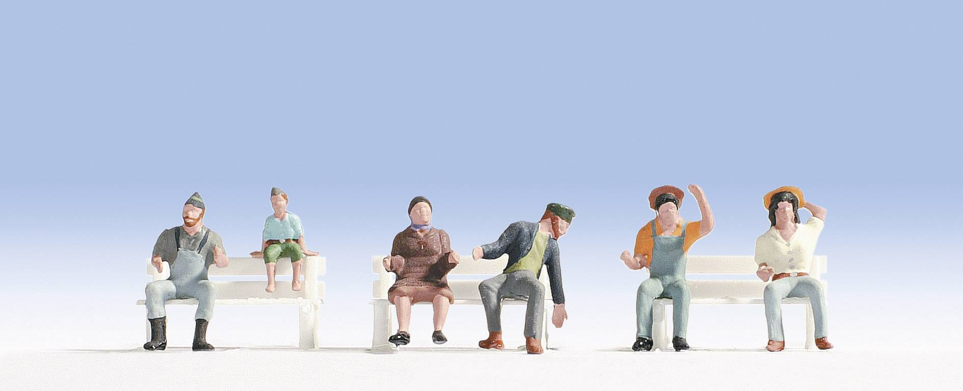 Several miniature figures sit on two benches against a blue sky. The figures are wearing different clothing and hats.