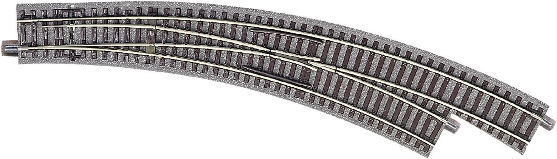 Model railway track system with two parallel curved tracks and a points switch that can change direction.