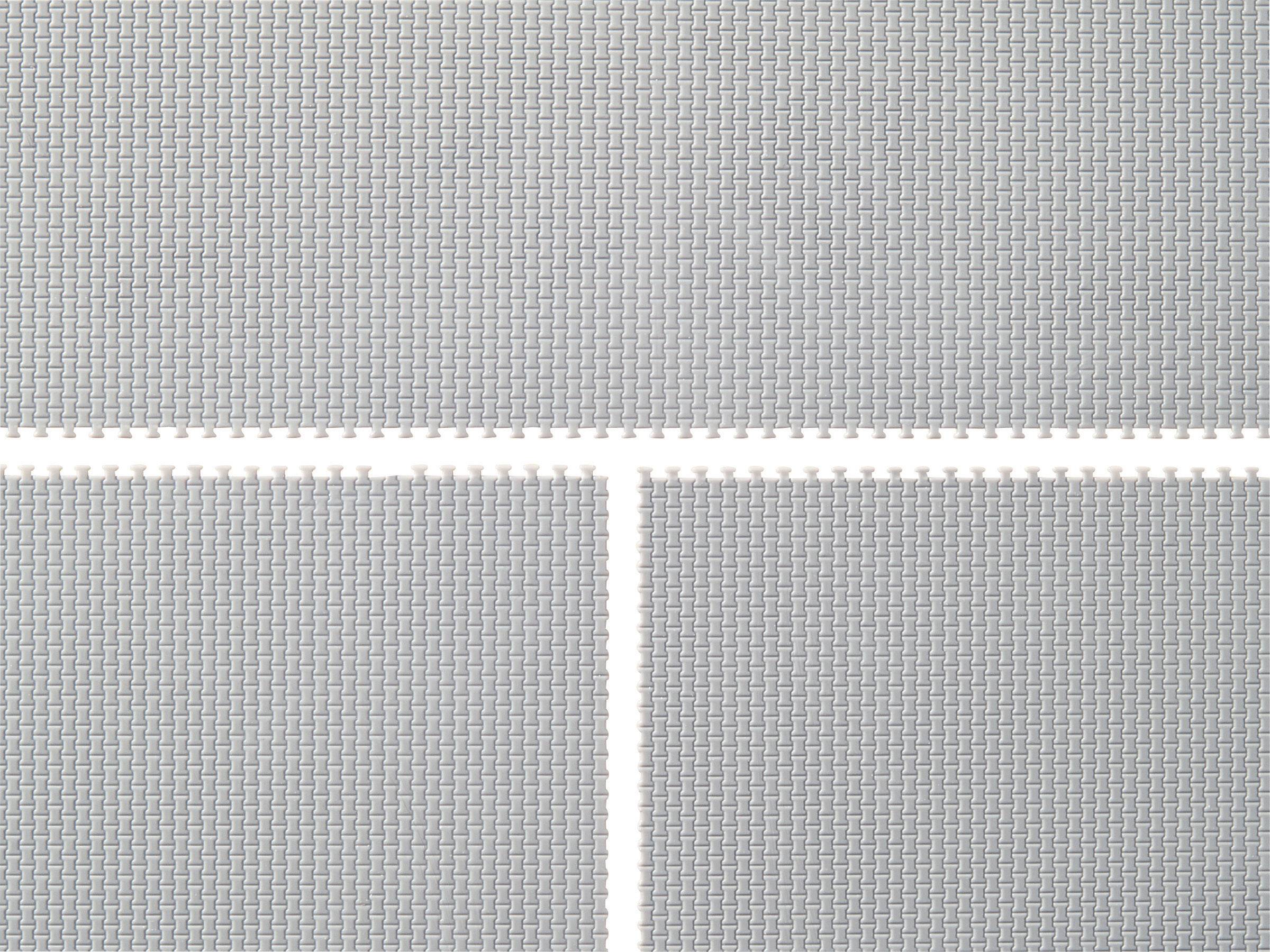 Grey mats with a woven pattern and white plastic connectors.