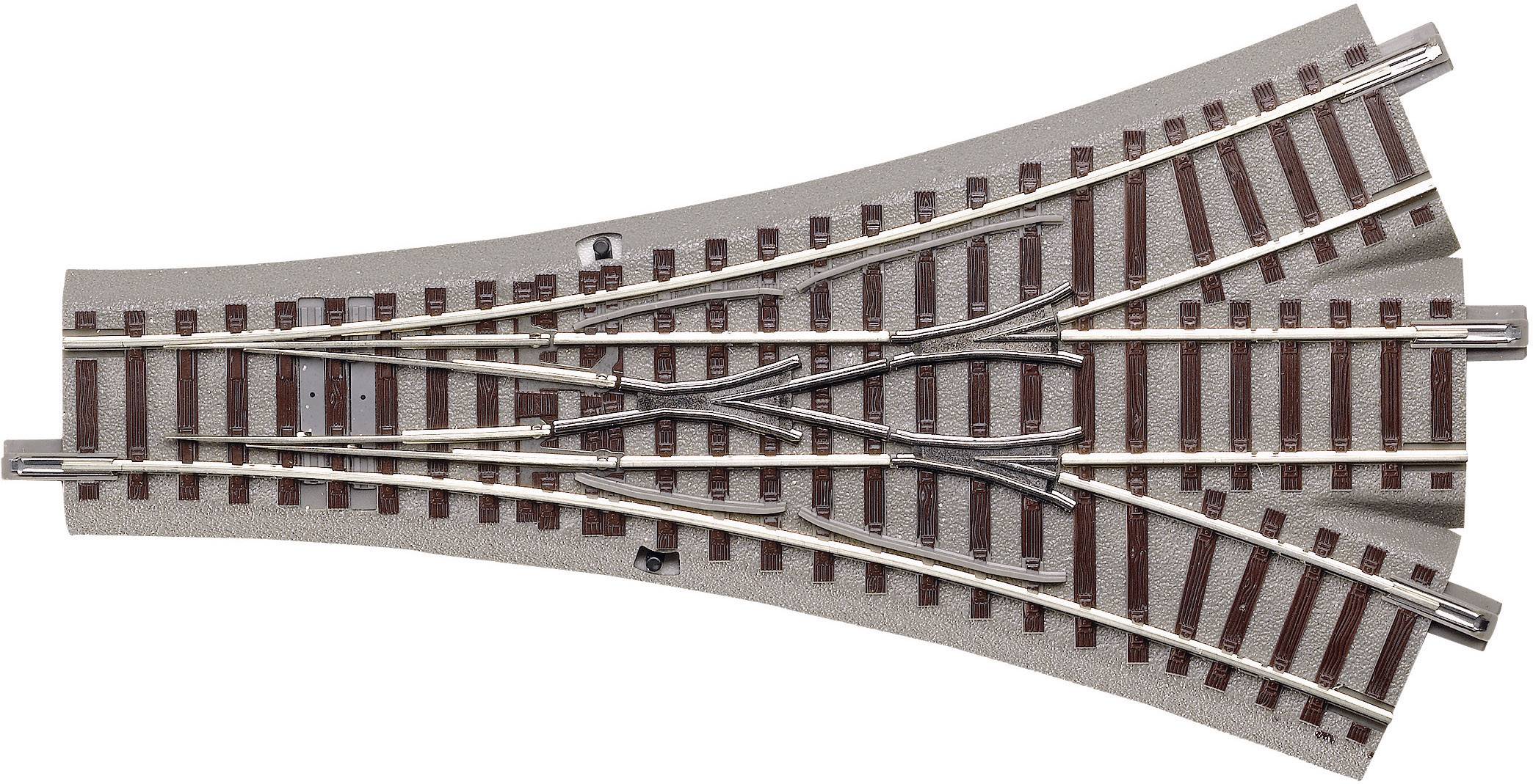 Metal and plastic railway point showing parallel track lines, enabling direction changes for model trains.