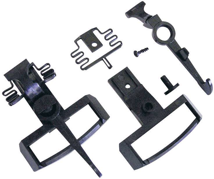 Various black spare parts and screws for a vehicle, including brackets and a fastening component.