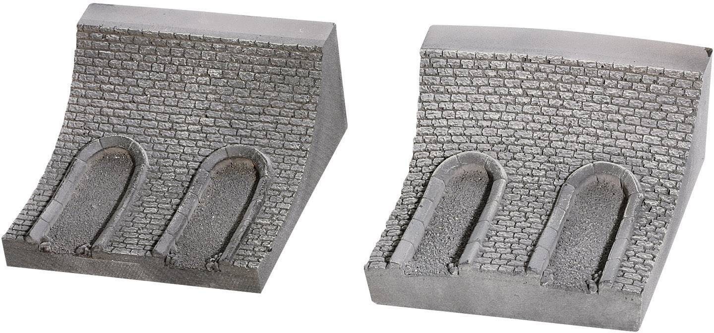 Two grey, curved wall sections, each with two arched tunnel openings. They are made from a stone-like material.