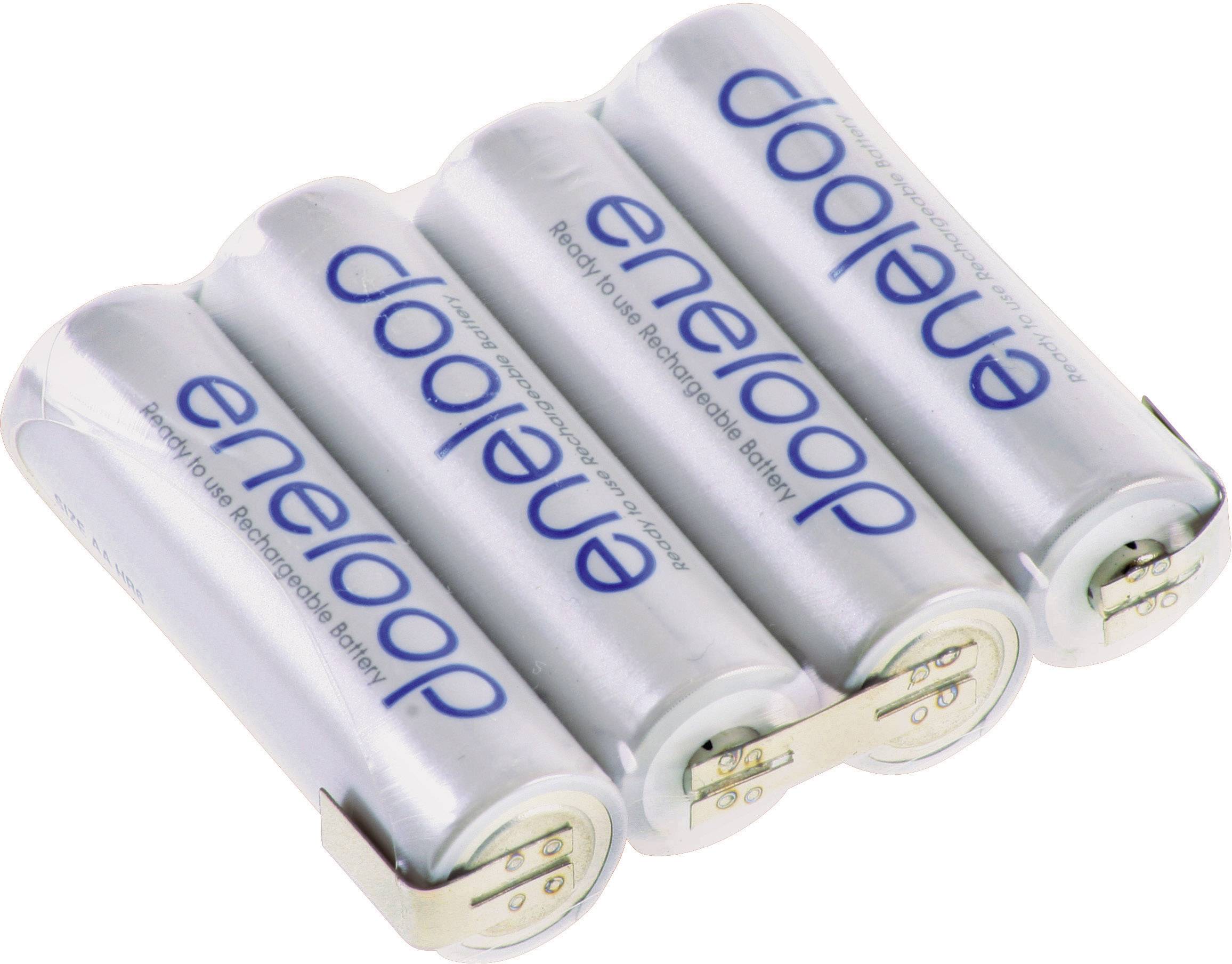 Four white, rechargeable AA batteries with the inscription 'eneloop', lying side by side.
