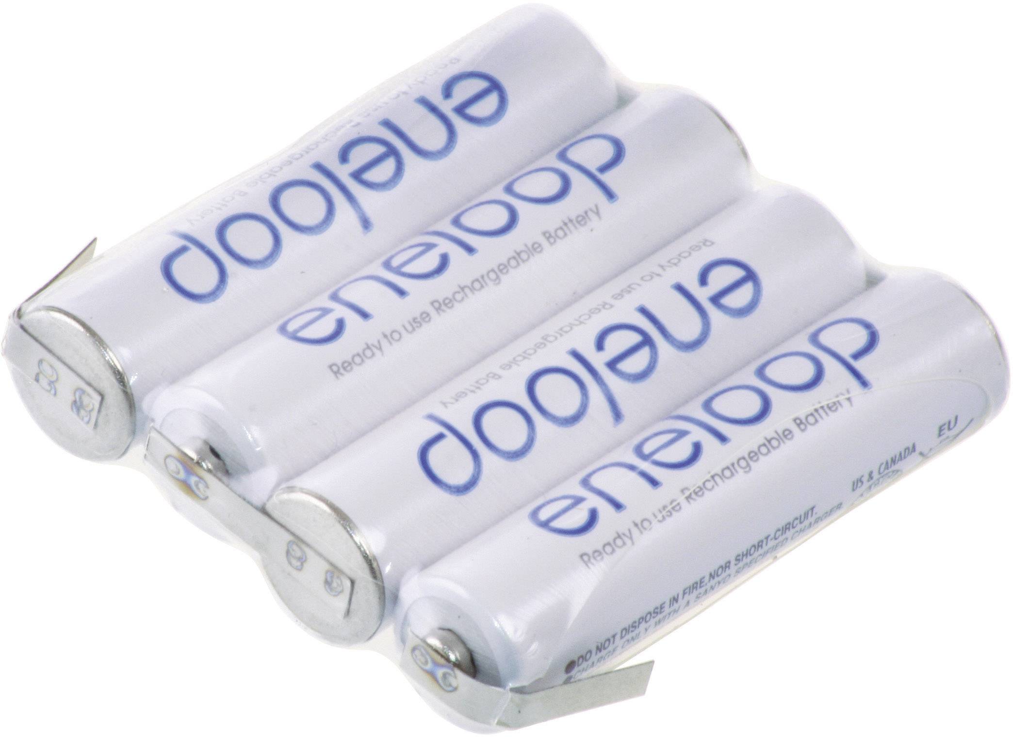 Four white Eneloop AA batteries are lying side by side.