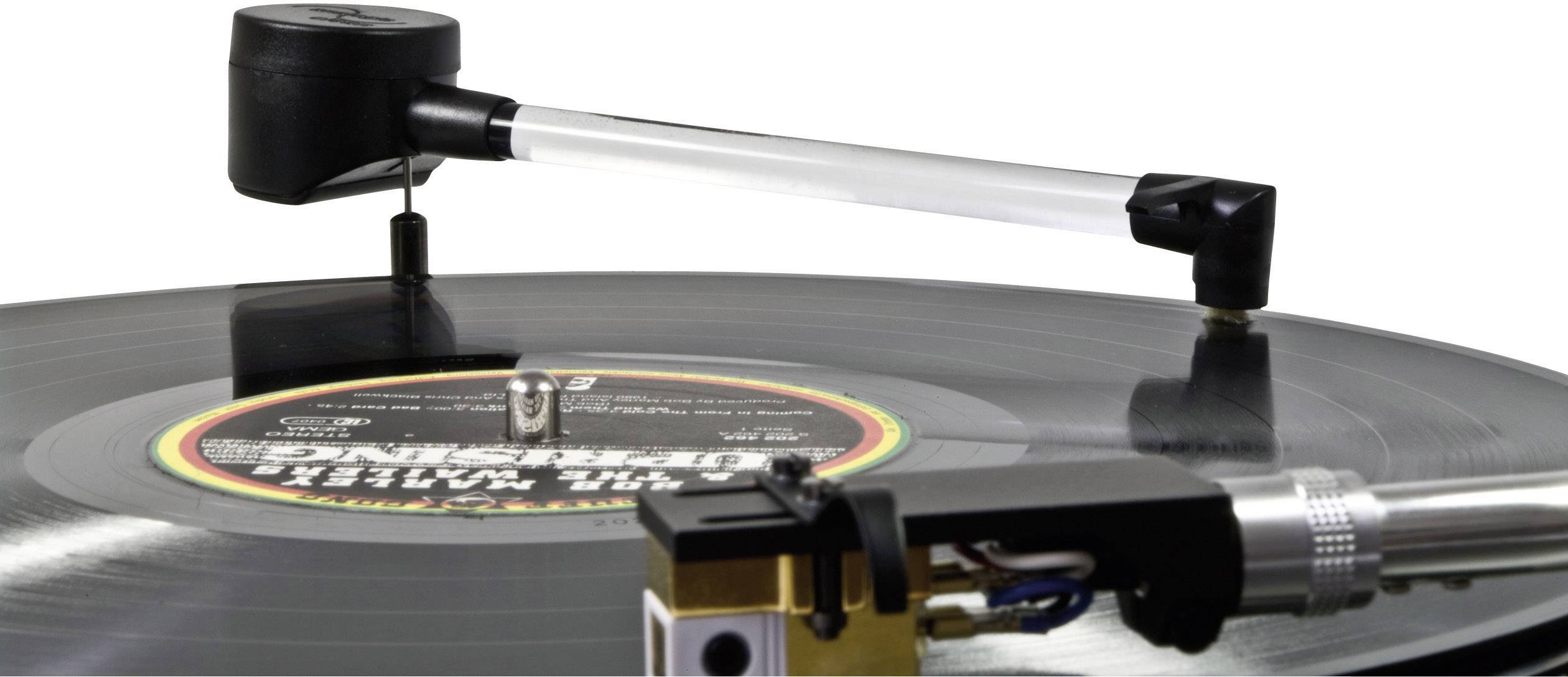 A turntable's tonearm touches a rotating black vinyl record.