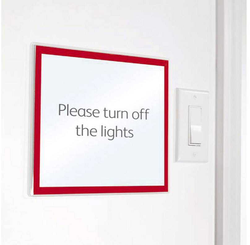 White light switch next to a sign with a red border. The sign reads: 'Please switch off the lights'.