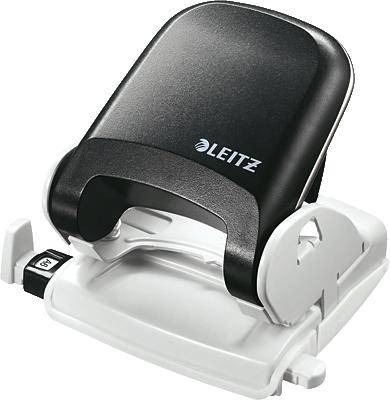 A black and white Leitz hole punch is resting on a surface.